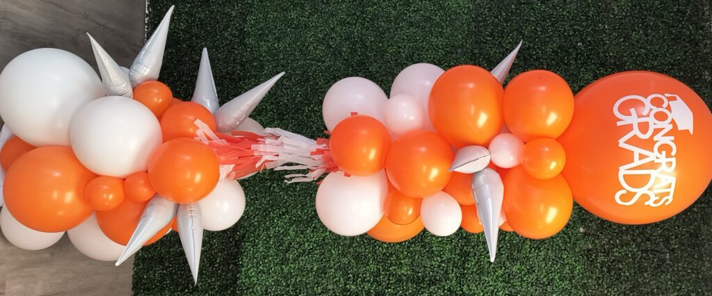 UT Orange and white balloon column with custom printed toper