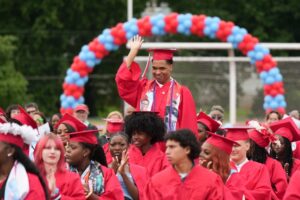 austin east graduation 2025 Students in front of balloon arch