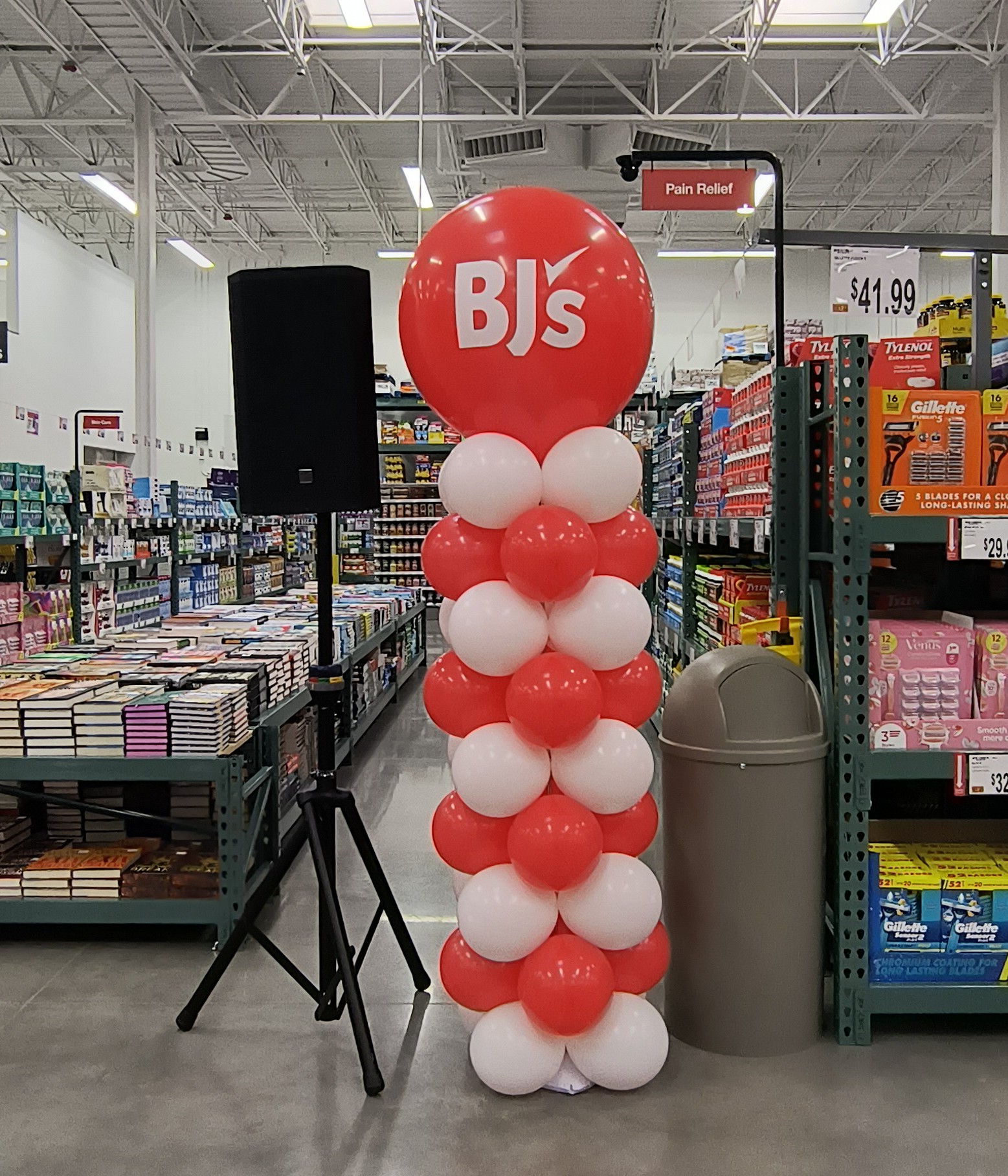 Red and white branded balloon column with BJ's logo inside BJ's Wholesale Club in Sevierville TN