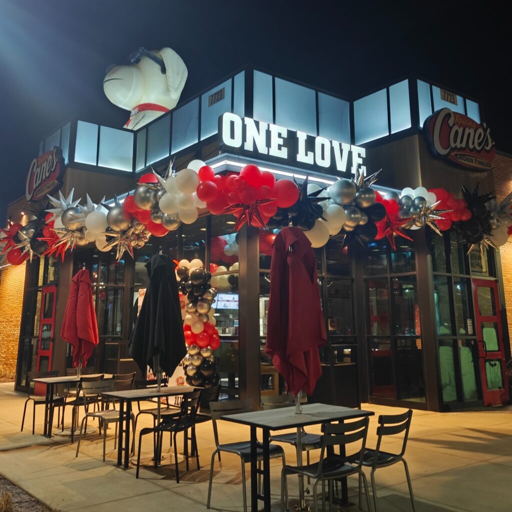 Organic balloon arch balloon decorations Knoxville at Raising Cane's grand opening