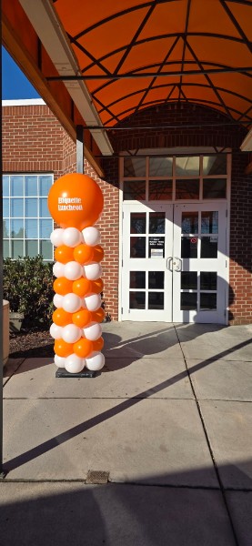 Balloons Knoxville TN tall orange and white balloon columns for UT Creamery etiquette luncheon