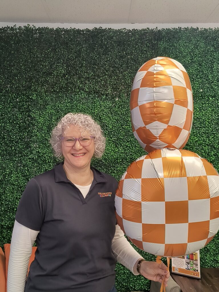 Checkerboard orange and white balloons